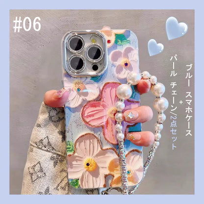【グッズ】iPhone 16 Pro Max / 15 Pro / 13 / 13 PM  用 ブルーライトカット 油絵フラワー 韓国風 レディース 全面保護 レンズカバー付き 高級感 ストラップ付き 新作 スマホケース